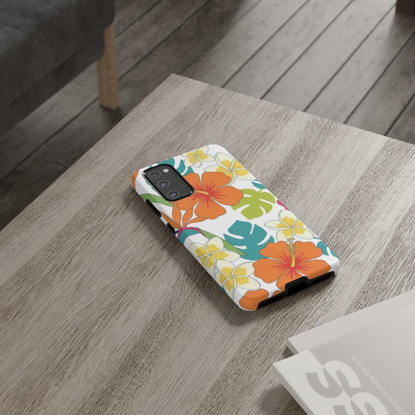 Orange floral Samsung case with vibrant protective design on wooden table