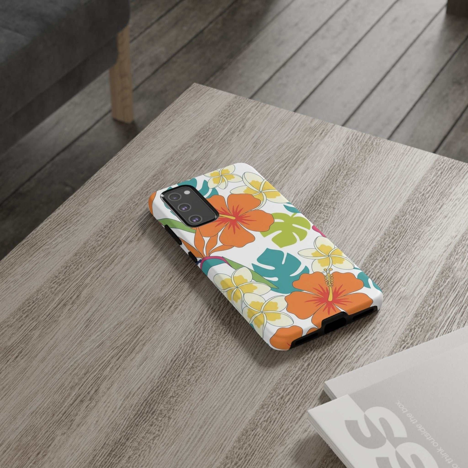 Orange floral Samsung case with vibrant protective design on wooden table
