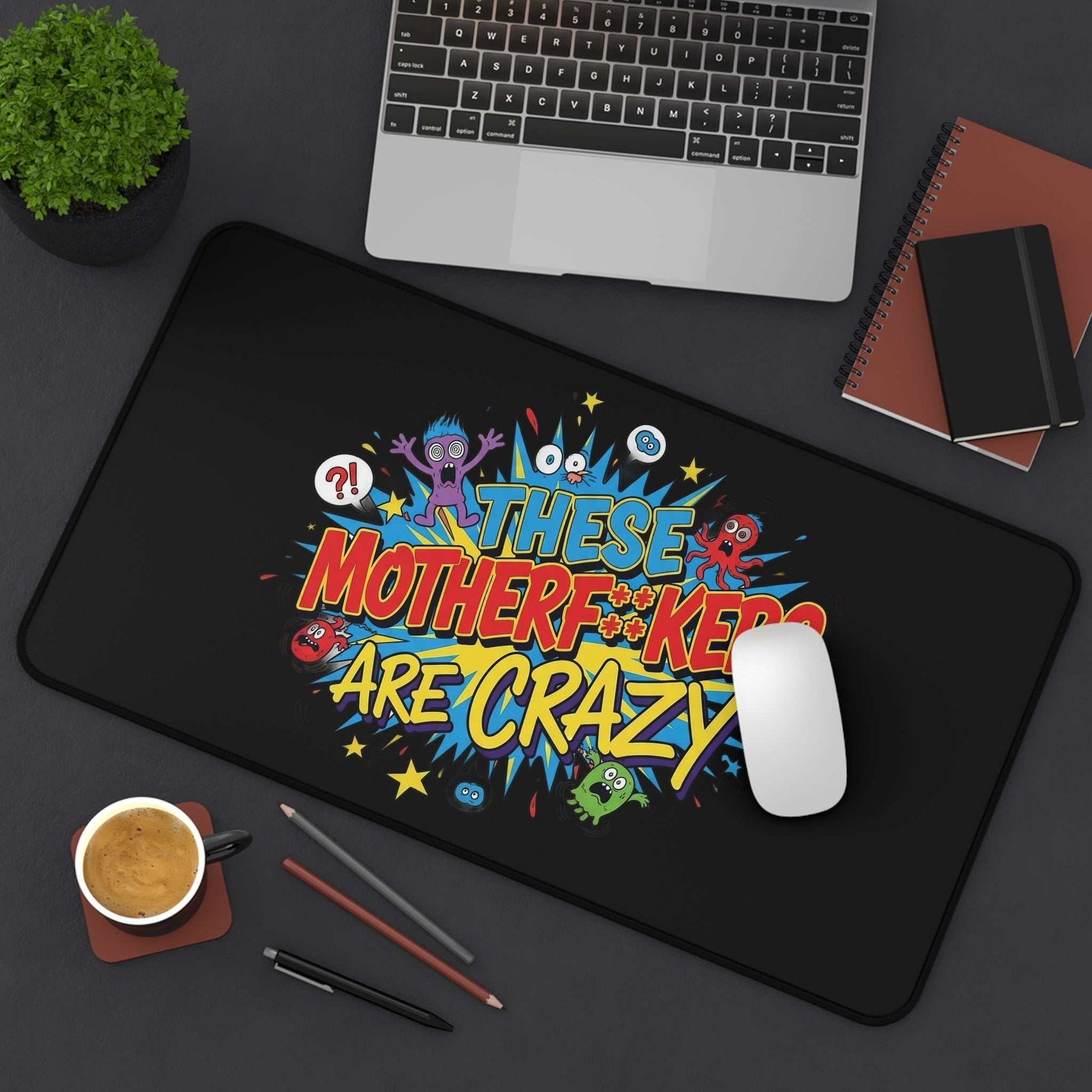 Colorful desk pad with bold "These Motherf++kers Are Crazy" text, non-slip, durable neoprene office mat