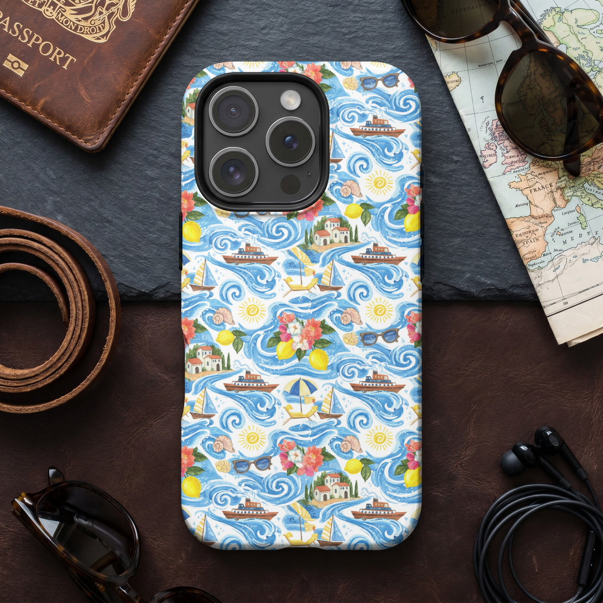 Phone case with a watercolor pattern of boats, sailboats, and coastal scenes.