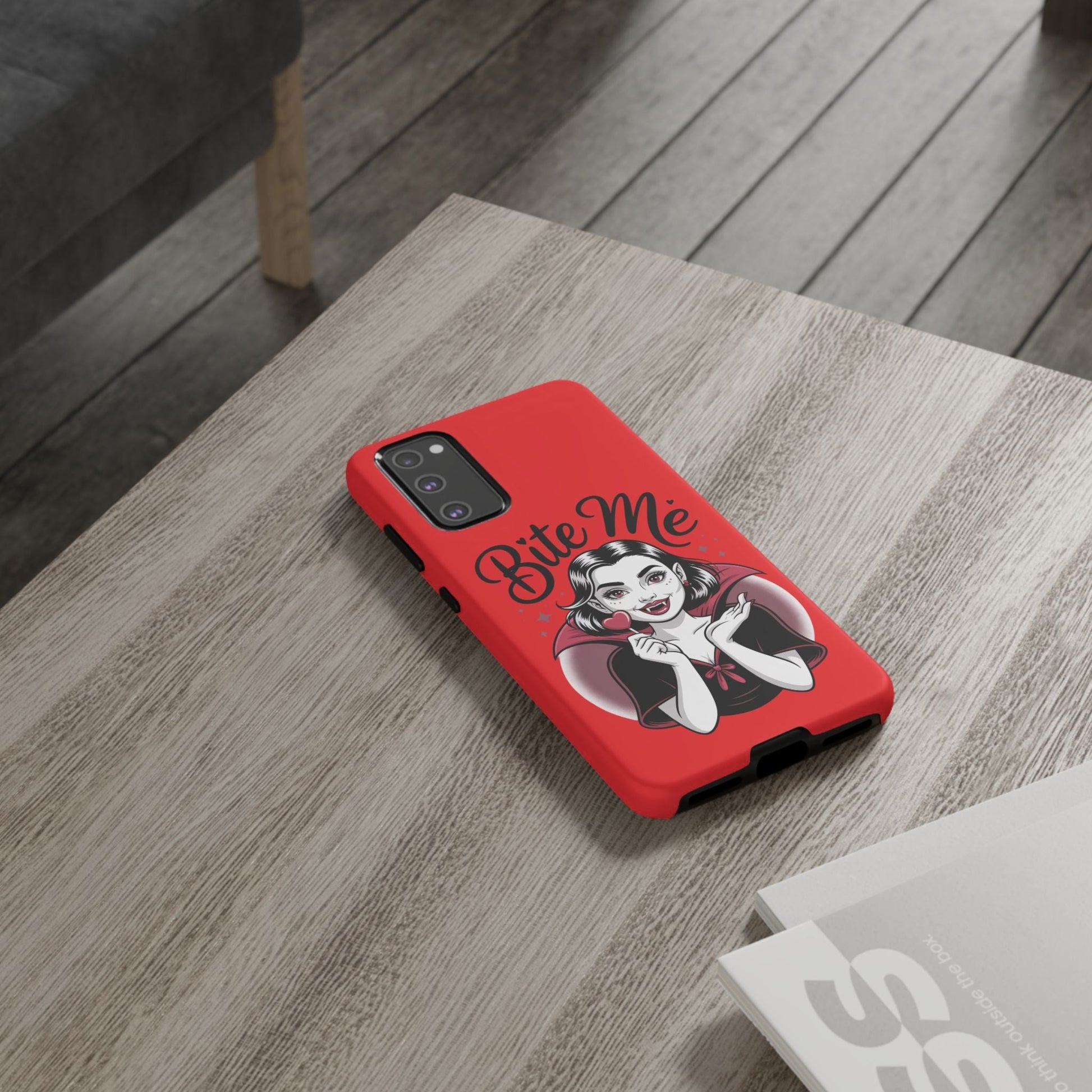 Bite Me Vampire Samsung phone case with red background and vampire girl illustration, durable and impact-resistant design for Halloween fans.