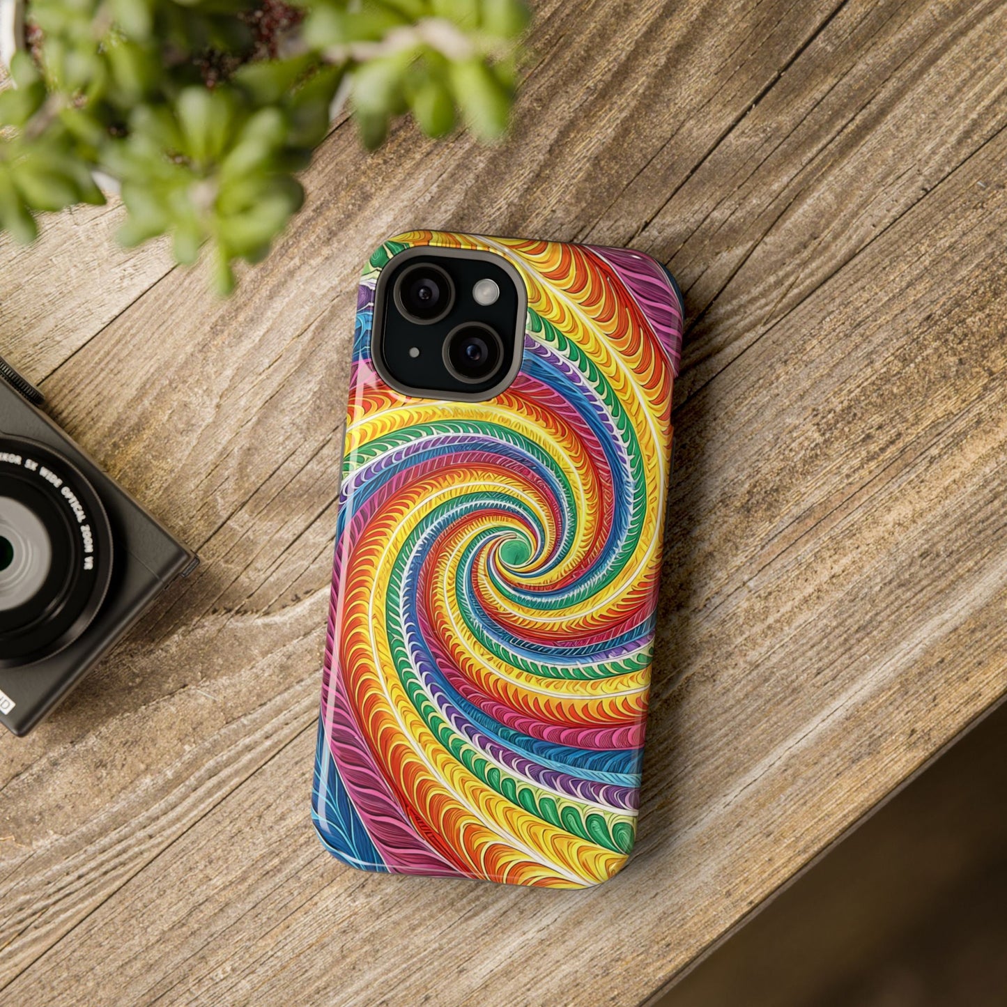 Rainbow Swirl iPhone Tough Case with colorful spiral design and MagSafe® compatibility on wooden surface