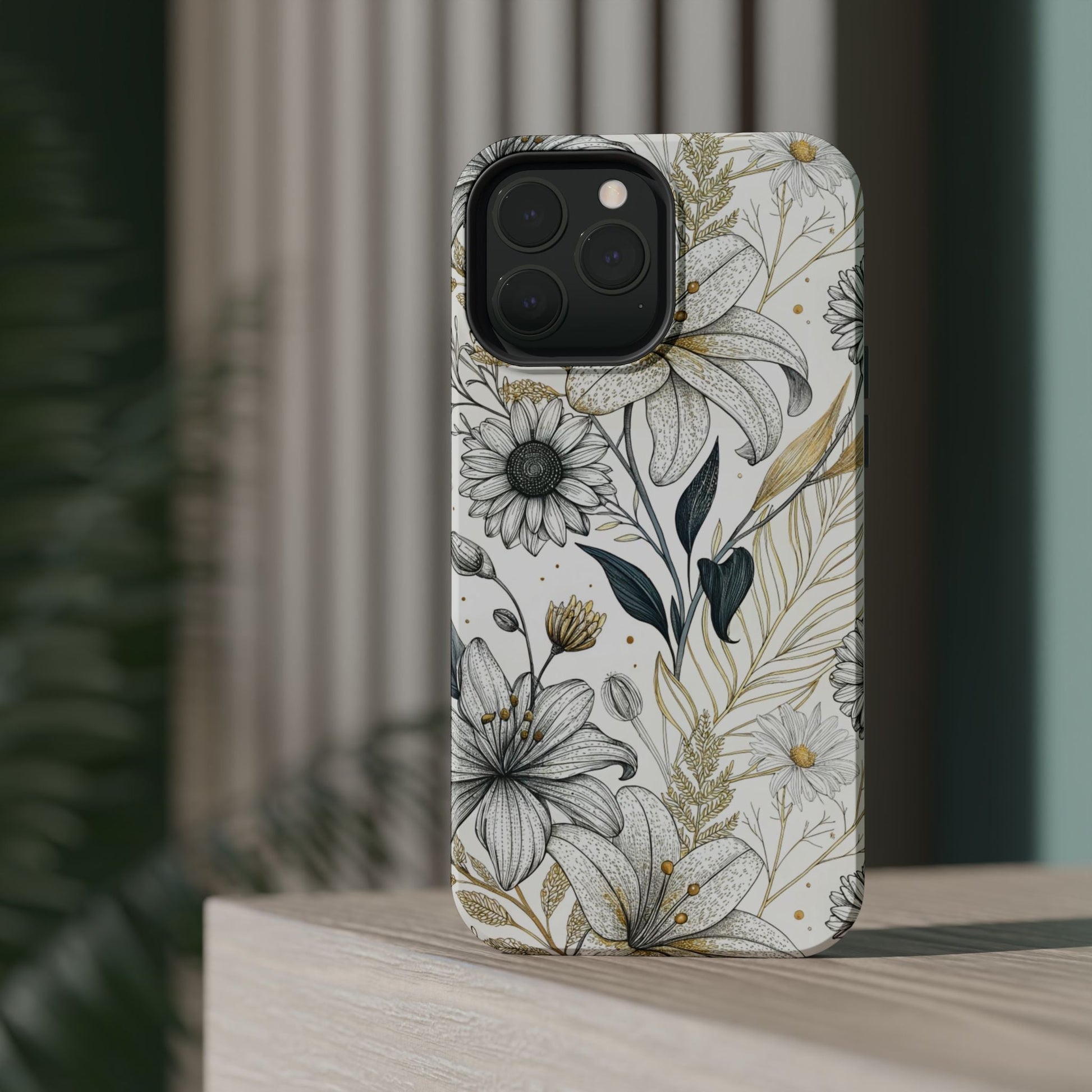 iPhone case with golden leaf flower design, dual-layer protection, and MagSafe compatibility