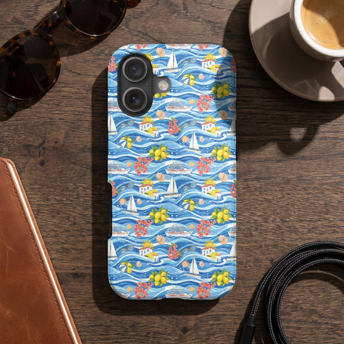 Phone case with blue wavy pattern featuring cruise ships, sailboats, lemons, flowers, and houses.