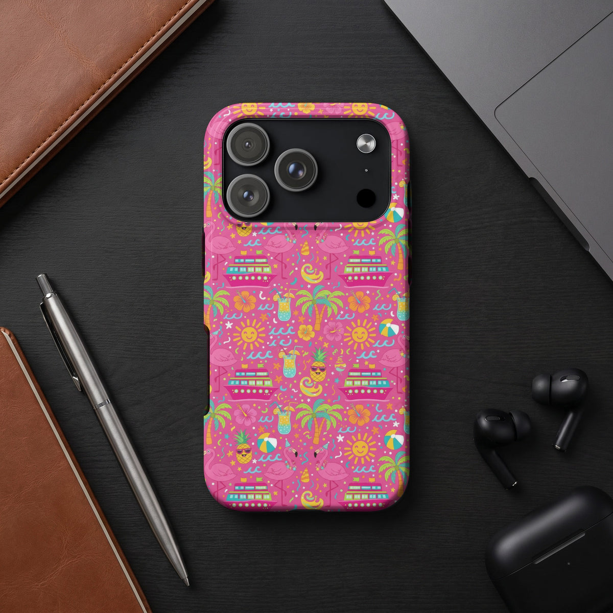 Pink phone case with a tropical pattern of flamingos, cruise ships, and drinks.
