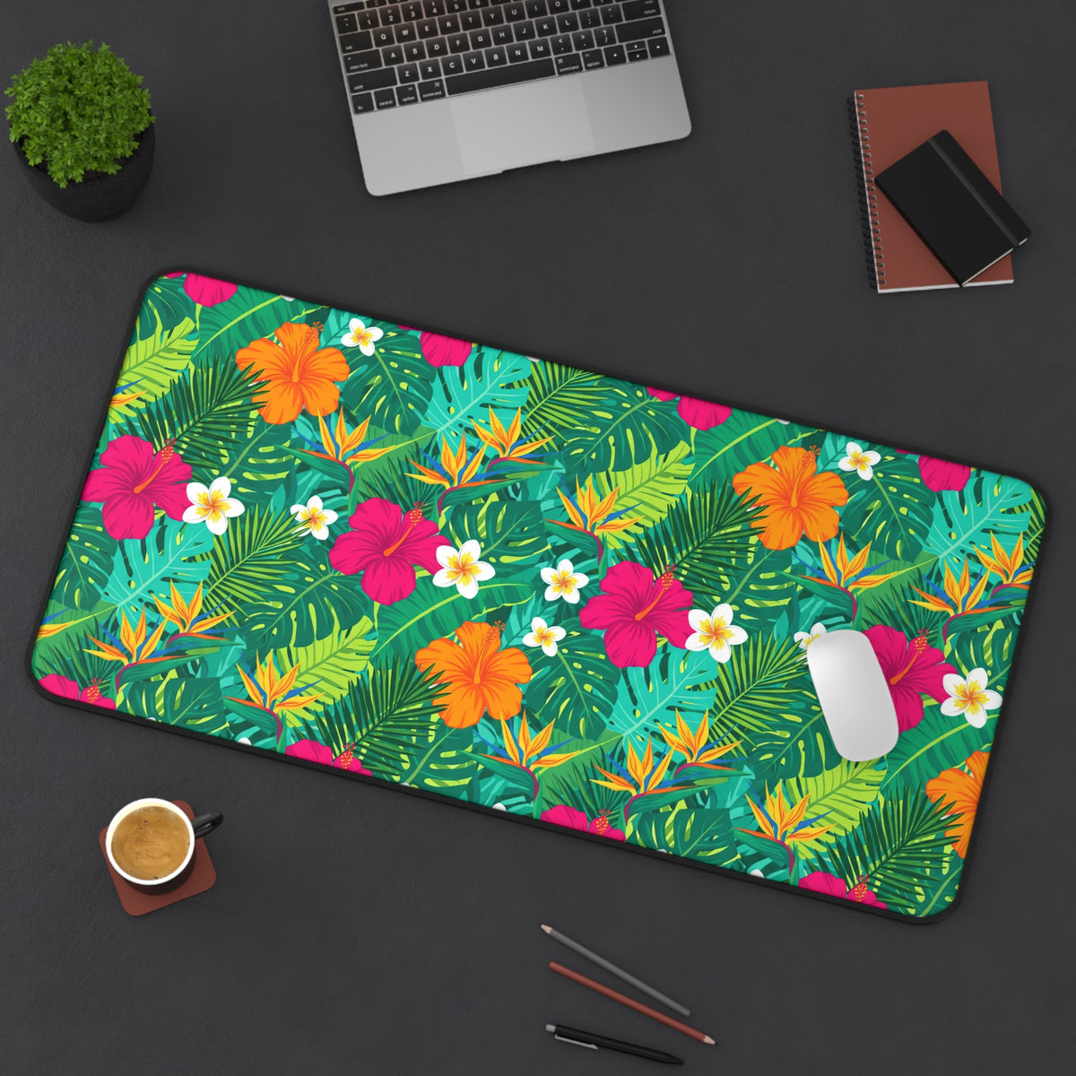 Tropical floral desk mat with hibiscus, bird of paradise, and palm leaves pattern.