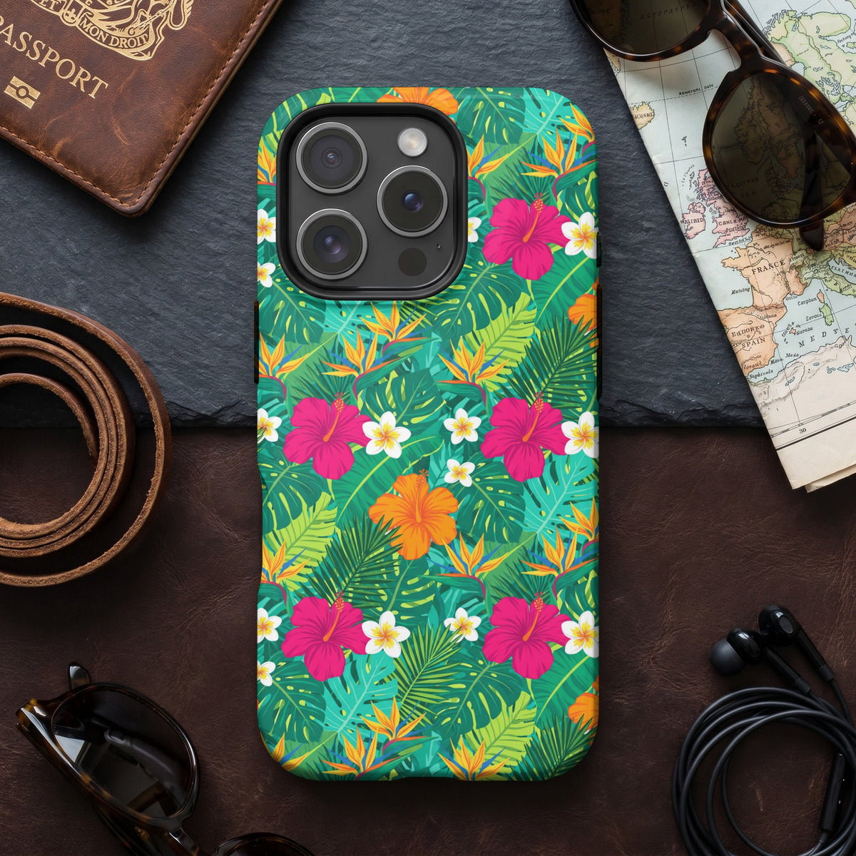 iPhone case with a green tropical leaf and floral pattern.