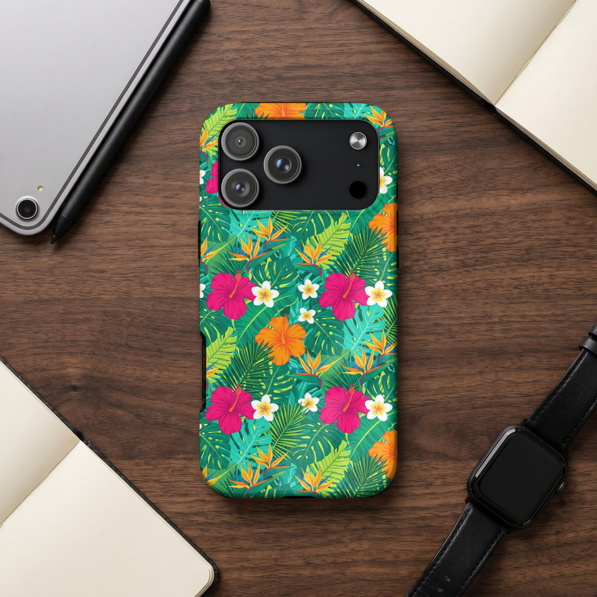 Phone case with tropical floral print, featuring hibiscus and bird of paradise flowers.